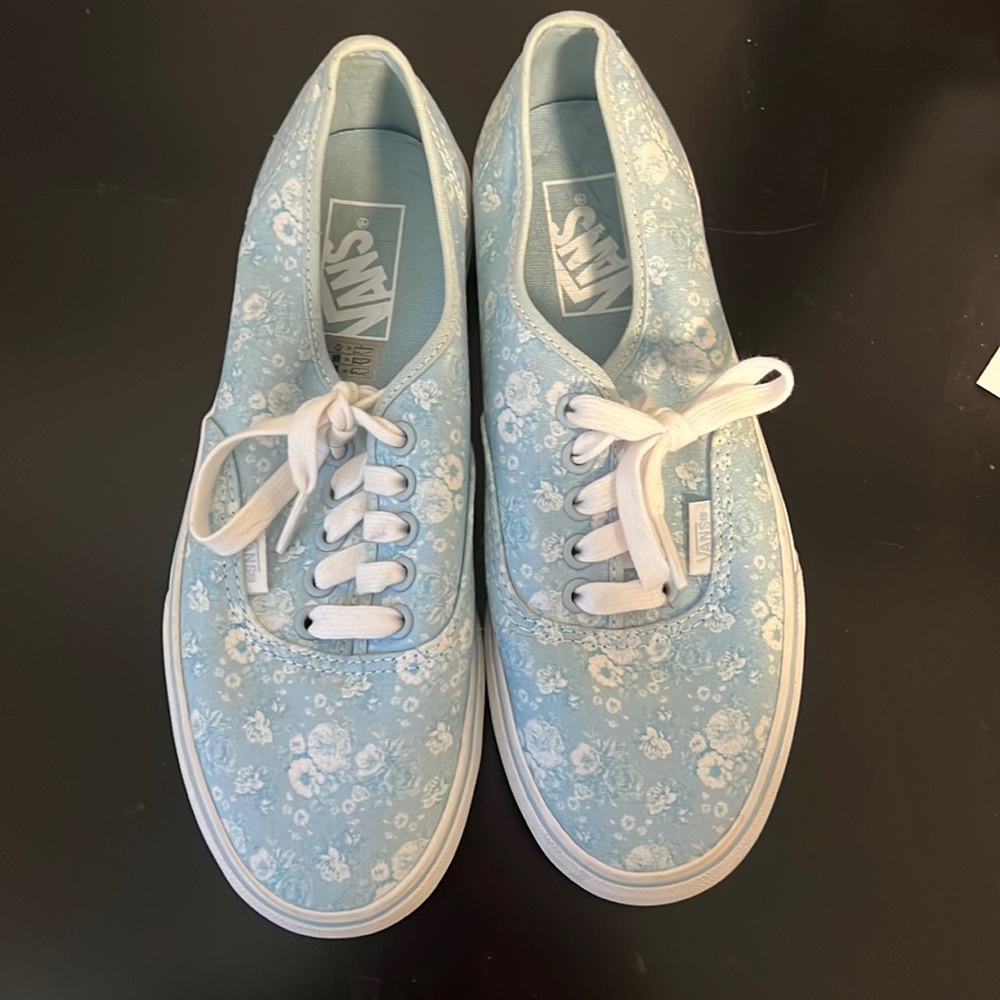 Platform blue vans with white flowers.